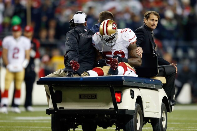 SEATTLE, WA - JANUARY 19:  Linebacker NaVorro Bowman #53 of the San Francisco 49ers is carted off the field in the fourth quarter against the Seattle Seahawks during the 2014 NFC Championship at CenturyLink Field on January 19, 2014 in Seattle, Washington.  (Photo by Otto Greule Jr/Getty Images)