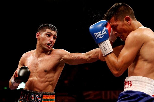 SHEFFIELD, ENGLAND - APRIL 27:  Amir Khan in action against Julio Diaz at Motorpoint Arena on April 27, 2013 in Sheffield, England.  (Photo by Scott Heavey/Getty Images)
