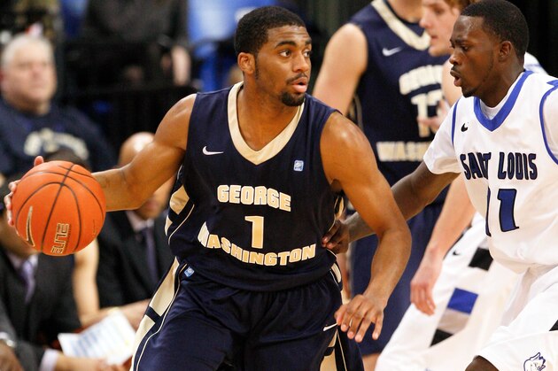 Feb 22, 2014; St. Louis, MO, USA; George Washington Colonials guard Maurice Creek (1) moves to the basket past Saint Louis Billikens guard Mike McCall Jr. (11) during the second half at Chaifetz Arena. Mandatory Credit: Scott Kane-USA TODAY Sports