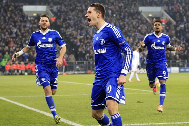 Schalke's Julian Draxler celebrates after scoring his side's opening goal during the Champions League group E soccer match between FC Schalke 04 and FC Basel in Gelsenkirchen, Germany, Wednesday, Dec.11,2013. (AP Photo/Frank Augstein)