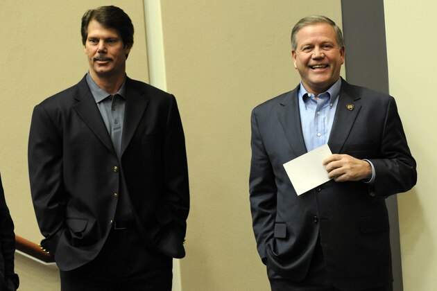 Notre Dame coach Brian Kelly, right, introduces Brian Van Gorder during a press conference introducing the new defensive coordinator Tuesday Jan. 14, 2013 in South Bend, Ind. (AP Photo/Joe Raymond)