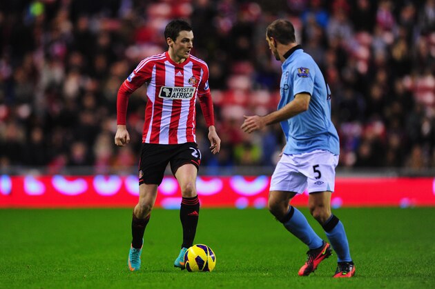 SUNDERLAND, ENGLAND - DECEMBER 26:  Manchester City fullback Pablo Zabaleta (r)is run at by Sunderland winger Adam Johnson during the Barclays Premier League match between Sunderland and Manchester City at Stadium of Light on December 26, 2012 in Sunderland, England.  (Photo by Stu Forster/Getty Images)