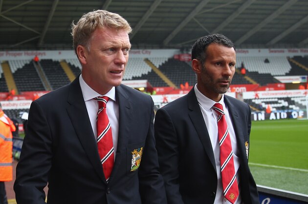 SWANSEA, WALES - AUGUST 17:  Manager David Moyes (L) of Manchester United walks alongside Ryan Giggs (R) towards the dressing room ahead of  the Barclays Premier League match between Swansea City and Manchester United at the Liberty Stadium on August 17, 2013 in Swansea, Wales.  (Photo by Michael Steele/Getty Images)
