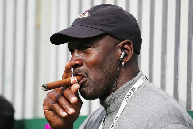 KILDARE, IRELAND - SEPTEMBER 22:  Michael Jordan smokes a cigar and watches the action during the morning fourballs of the first day of the 2006 Ryder Cup at The K Club on September 22, 2006 in Straffan, Co. Kildare, Ireland.  (Photo by Ross Kinnaird/Getty Images)