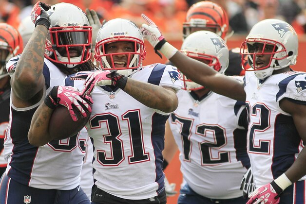 New England Patriots cornerback Aqib Talib (31) celebrates against the Cincinnati Bengals in an NFL football game, Sunday, Oct. 6, 2013, in Cincinnati. (AP Photo/Tom Uhlman)