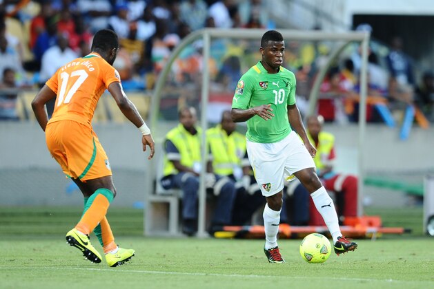 RUSTENBURG, SOUTH AFRICA - JANUARY 22: Tiene Siaka of Ivory Coast and Floyed Ayite during the 2013 Orange African Cup of Nations match between Ivory Coast and Togo from Royal Bafokeng Stadium on January 22, 2012 in Rustenburg, South Africa. (Photo by Lefty Shivambu/Gallo Images)