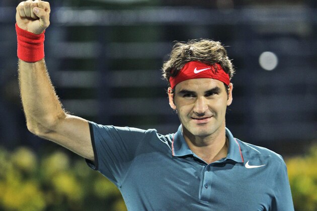 Roger Federer of Switzerland celebrates after he beat Novak Djokovic of Serbia during a semifinal match of the Dubai Tennis Championships in Dubai, United Arab Emirates, Friday, Feb. 28, 2014. (AP Photo/Kamran Jebreili)