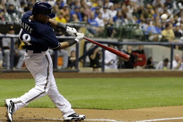 Milwaukee Brewers' Khris Davis hits a two-run home run during the second inning of a baseball game against the Pittsburgh Pirates, Wednesday, Sept. 4, 2013, in Milwaukee. (AP Photo/Morry Gash)