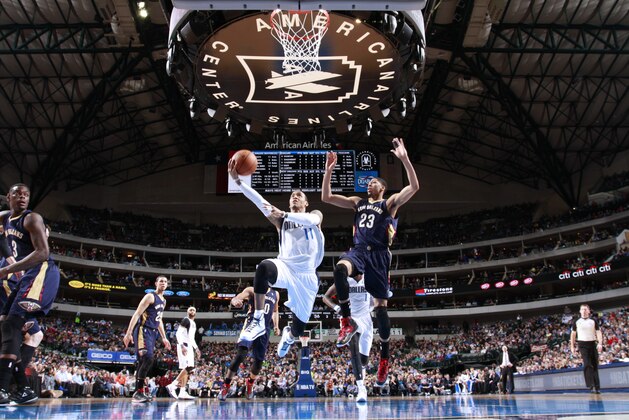DALLAS, TX - FEBRUARY 26: Monta Ellis #11 of the Dallas Mavericks goes to the basket against Anthony Davis #23 of the New Orleans Pelicans on February 26, 2014 at the American Airlines Center in Dallas, Texas. NOTE TO USER: User expressly acknowledges and agrees that, by downloading and or using this photograph, User is consenting to the terms and conditions of the Getty Images License Agreement. Mandatory Copyright Notice: Copyright 2014 NBAE (Photo by Danny Bollinger/NBAE via Getty Images)