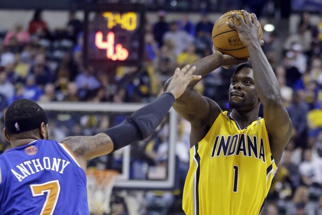 Indiana Pacers guard Lance Stephenson shoots over New York Knicks forward Carmelo Anthony during the second half of an NBA basketball game in Indianapolis, Thursday, Jan. 16, 2014. The Pacers defeated the Knicks 117-89. (AP Photo/Michael Conroy)