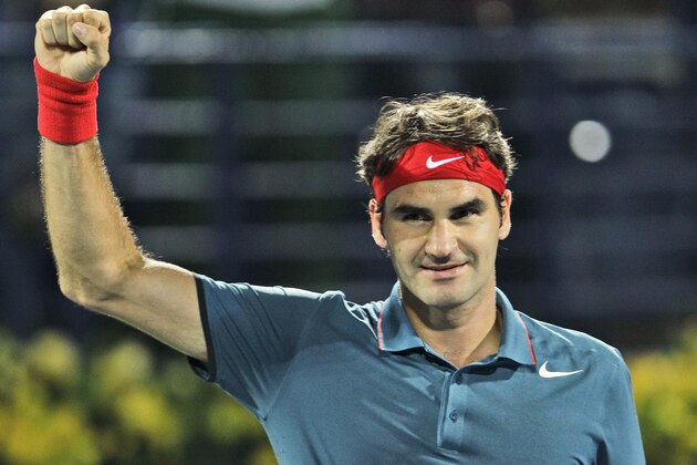 Roger Federer of Switzerland celebrates after he beat Novak Djokovic of Serbia during a semifinal match of the Dubai Tennis Championships in Dubai, United Arab Emirates, Friday, Feb. 28, 2014. (AP Photo/Kamran Jebreili)