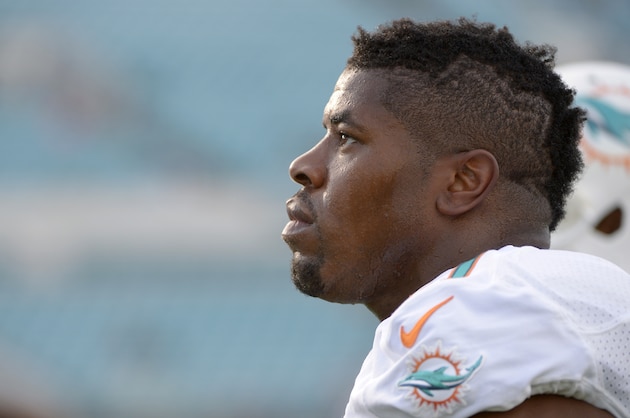 Miami Dolphins defensive end Cameron Wake (91) warms up prior to an NFL preseason football game against the Jacksonville Jaguars in Jacksonville, Fla., Friday, Aug. 9, 2013. (AP Photo/Phelan M. Ebenhack)