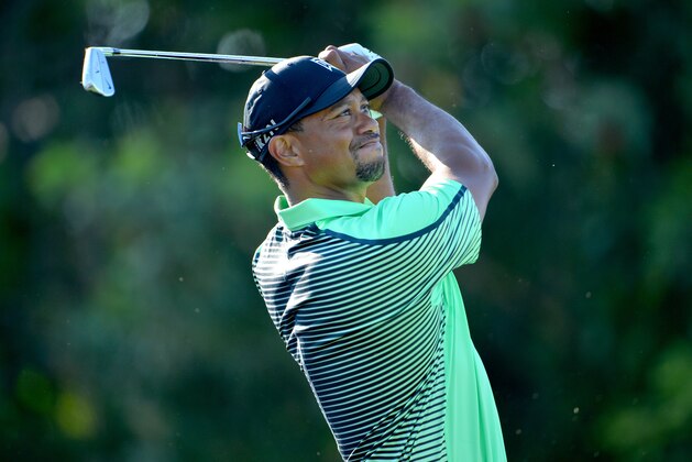 PALM BEACH GARDENS, FL - FEBRUARY 28: Tiger Woods of USA plays a shot during the second round of The Honda Classic at PGA National Resort and Spa on February 28, 2014 in Palm Beach Gardens, Florida. (Photo by Stuart Franklin/Getty Images) PALM BEACH GARDENS, FL - FEBRUARY 28: Tiger Woods of USA plays a shot during the second round of The Honda Classic at PGA National Resort and Spa on February 28, 2014 in Palm Beach Gardens, Florida. (Photo by Stuart Franklin/Getty Images)