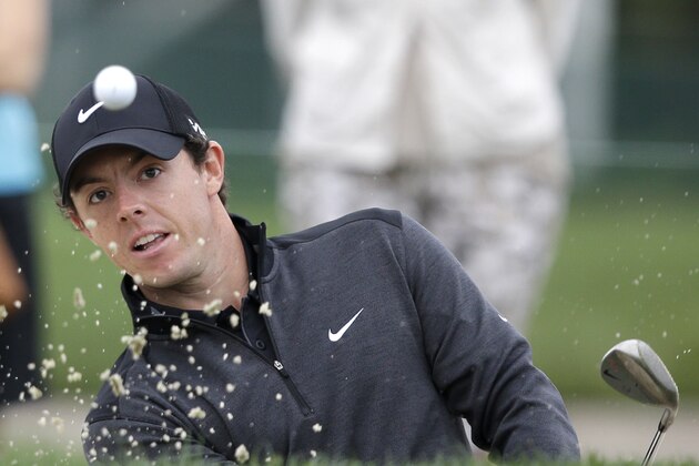 Golfer Rory McIlroy of Northern Ireland hits out of a sand trap on the 13th hole during the second round of the Honda Classic golf tournament, Friday, Feb. 28, 2014 in Palm Beach Gardens, Fla. (AP Photo/Wilfredo Lee)
