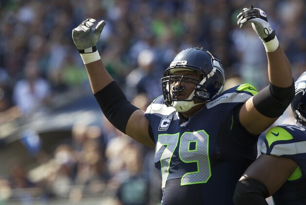 SEATTLE, WA - SEPTEMBER 16: Red Bryant #79 of the Seattle Seahawks gets the crowd involved during a game against the Dallas Cowboys at CenturyLink Field on September 16, 2012 in Seattle, Washington. (Photo by Stephen Brashear/Getty Images)
