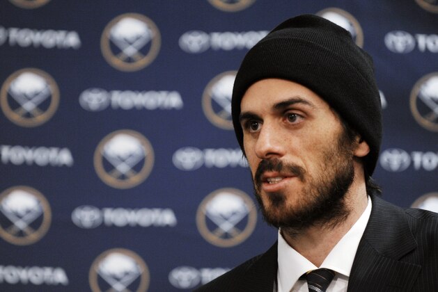 Former Buffalo Sabres goaltender Ryan Miller talks about the trade that sent him to the St. Louis Blues, after the first period of the Sabres' NHL hockey game against the San Jose Sharks in Buffalo, N.Y., Friday, Feb. 28, 2014. (AP Photo/Gary Wiepert)