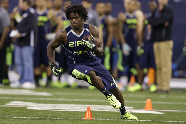 Kent State running back Dri Archer runs a drill at the NFL football scouting combine in Indianapolis, Sunday, Feb. 23, 2014. (AP Photo/Michael Conroy)