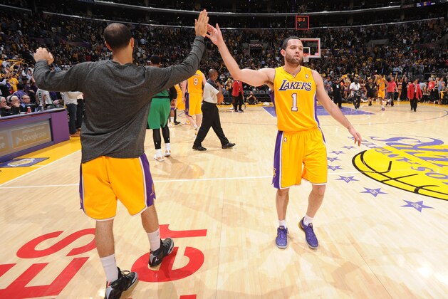 LOS ANGELES, CA - FEBRUARY 21: Kendall Marshall #12 and Jordan Farmar #1 of the Los Angeles Lakers high five after a game against the Boston Celtics at STAPLES Center on February 21, 2014 in Los Angeles, California. NOTE TO USER: User expressly acknowledges and agrees that, by downloading and/or using this Photograph, user is consenting to the terms and conditions of the Getty Images License Agreement. Mandatory Copyright Notice: Copyright 2014 NBAE (Photo by Andrew D. Bernstein/NBAE via Getty Images)