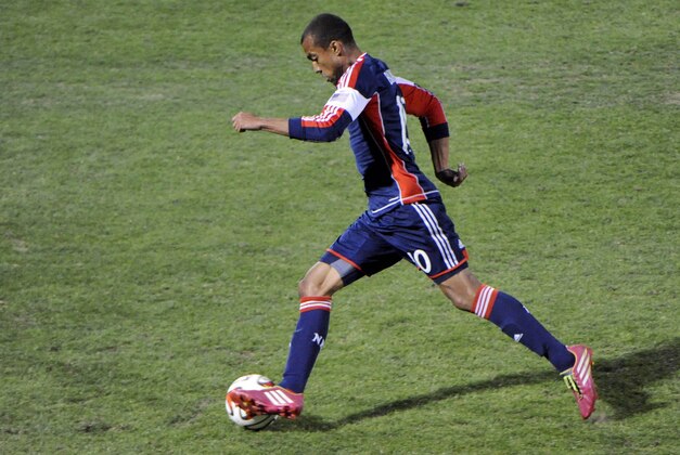 Feb 22, 2014; Tucson, AZ, USA; New England Revolution forward Teal Bunbury (10) dribbles the ball during the first half against Chivas USA at Kino Sports Complex. Mandatory Credit: Casey Sapio-USA TODAY Sports