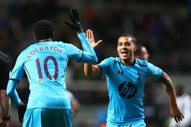 NEWCASTLE UPON TYNE, ENGLAND - FEBRUARY 12:  Emmanuel Adebayor (L) of Tottenham Hotspur celebrates scoring his sides third goal with Kyle Naughton (R) during the Barclays Premier League match between Newcastle United and Tottenham Hotspur at St James' Park on February 12, 2014 in Newcastle upon Tyne, England.  (Photo by Michael Steele/Getty Images)