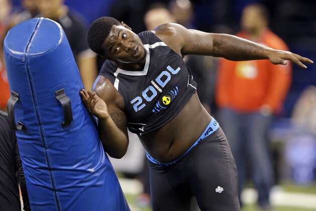 Florida State defensive lineman Timmy Jernigan runs a drill at the NFL football scouting combine in Indianapolis, Monday, Feb. 24, 2014. (AP Photo/Michael Conroy)