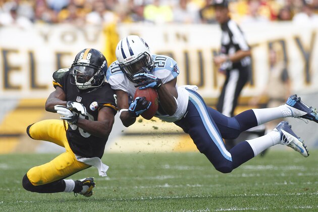 PITTSBURGH, PA - SEPTEMBER 08: Alterraun Verner #20 of the Tennessee Titans intercepts a pass intended for Emmanuel Sanders #88 of the Pittsburgh Steelers in the first half during the game on September 8, 2013 at Heinz Field in Pittsburgh, Pennsylvania. (Photo by Justin K. Aller/Getty Images)
