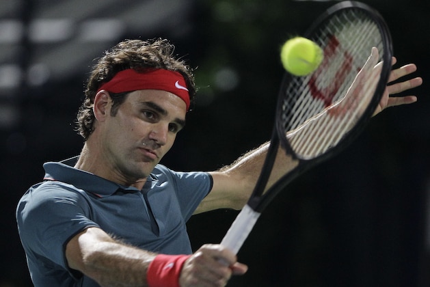 Roger Federer of Switzerland returns the ball to Novak Djokovic of Serbia during a semi final match of the Dubai Duty Free Tennis Championships in Dubai, United Arab Emirates, Friday, Feb. 28, 2014. (AP Photo/Kamran Jebreili) Roger Federer of Switzerland returns the ball to Novak Djokovic of Serbia during a semi final match of the Dubai Duty Free Tennis Championships in Dubai, United Arab Emirates, Friday, Feb. 28, 2014. (AP Photo/Kamran Jebreili)