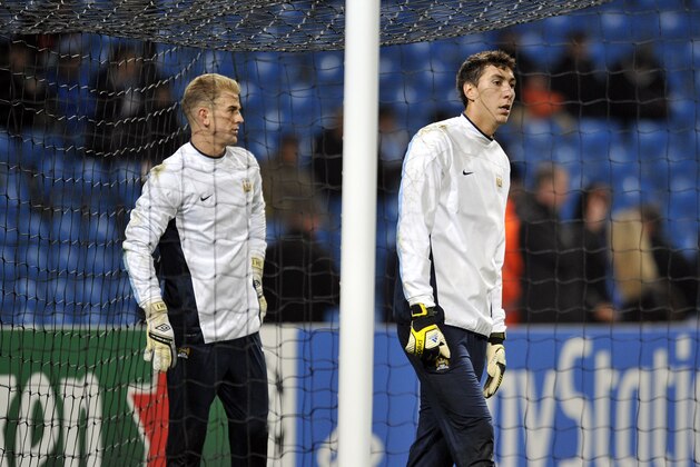 Manchester City goalkeepers Costel Pantilimon right, and Joe Hart warm up prior to kick off during the Champions League Group D soccer match against CSKA Moscow at the Etihad Stadium in Manchester, Britain, Tuesday, Nov. 5, 2013. (AP Photo / Clint Hughes)