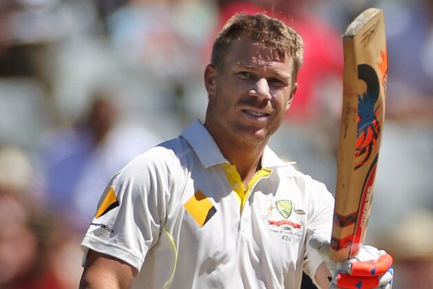 Australian David Warner, holds up his bat after making over a hundred run's during the opening day of the third cricket test match against South Africa in Cape Town, South Africa, Saturday, March 1, 2014.  (AP Photo/Schalk van Zuydam)