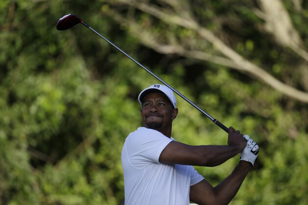 Tiger Woods tees off on the third hole during the third round of the Honda Classic golf tournament, Saturday, March 1, 2014, in Palm Beach Gardens, Fla. (AP Photo/Lynne Sladky)