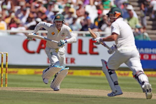 Australian Michael Clarke, left, makes a run with team mate, David Warner, right, during the opening day of the third cricket test match against South Africa in Cape Town, South Africa, Saturday, March 1, 2014.  (AP Photo/Schalk van Zuydam)
