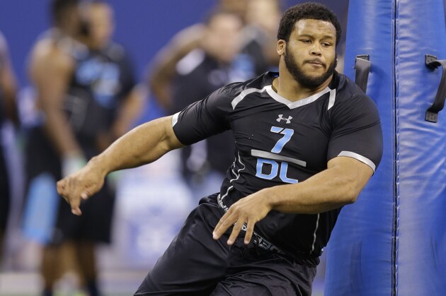 Pittsburgh defensive lineman Aaron Donald runs a drill at the NFL football scouting combine in Indianapolis, Monday, Feb. 24, 2014. (AP Photo/Michael Conroy)