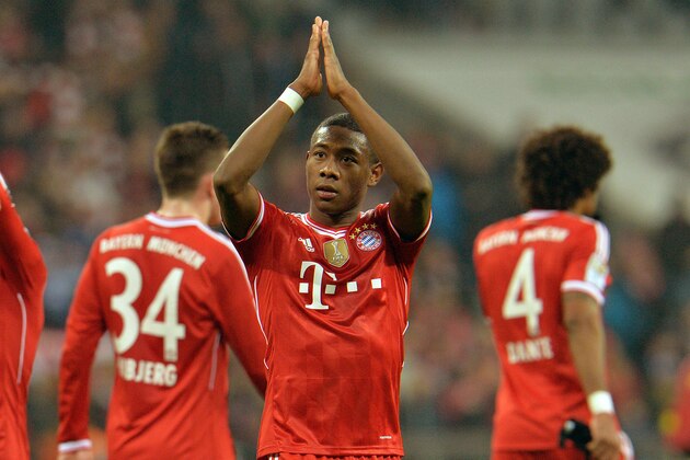 Bayern's David Alaba of Austria, center, reacts to supporters after the German first division Bundesliga soccer match between  FC Bayern Munich and FC Schalke in Munich, Germany, on Saturday, March 1,  2014. Bayern won 5-1. (AP Photo/Kerstin Joensson)