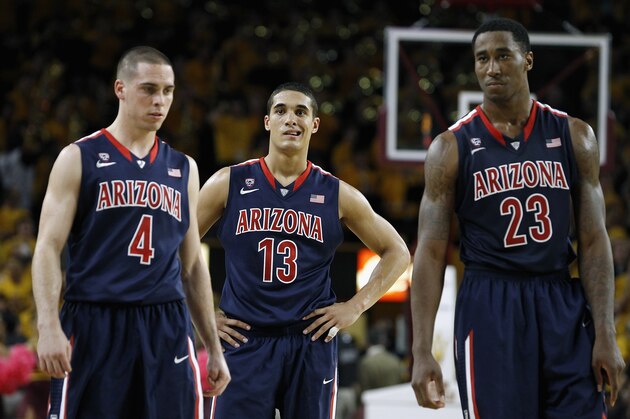 TEMPE, AZ - FEBRUARY 14:  T.J. McConnell #4, Nick Johnson #13 and Rondae Hollis-Jefferson #23 of the Arizona Wildcats walk on the court after a timeout against the Arizona State Sun Devils during the second half of a college basketball game at Wells Fargo Arena on February 14, 2014 in Tempe, Arizona.  (Photo by Ralph Freso/Getty Images)