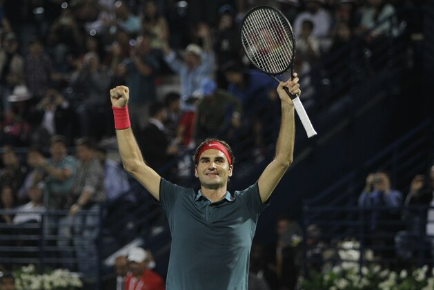 Roger Federer of Switzerland celebrates after beating Tomas Berdych of Czech Republic during the final match of the Dubai Duty Free Tennis Championships in Dubai, United Arab Emirates, Saturday, March 1, 2014. (AP Photo/Kamran Jebreili)