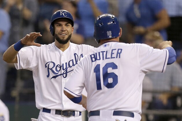 Kansas City Royals' Billy Butler (16) and Eric Hosmer celebrate after scoring on a two-run double by Salvador Perez during the first inning of a baseball game against the Cleveland Indians, Wednesday, Sept. 18, 2013, in Kansas City, Mo. (AP Photo/Charlie Riedel)