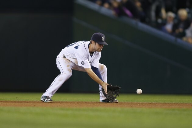 Seattle Mariners second baseman Nick Franklin fields the ball against the Oakland Athletics during a baseball game in Seattle on Saturday, Sept. 28, 2013. (AP Photo/John Froschauer)