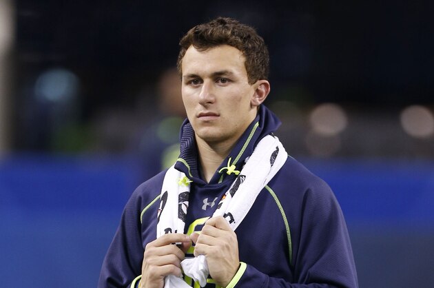Feb 23, 2014; Indianapolis, IN, USA; Texas A&M quarterback Johnny Manziel stands on the field during the 2014 NFL Combine at Lucas Oil Stadium. Mandatory Credit: Brian Spurlock-USA TODAY Sports