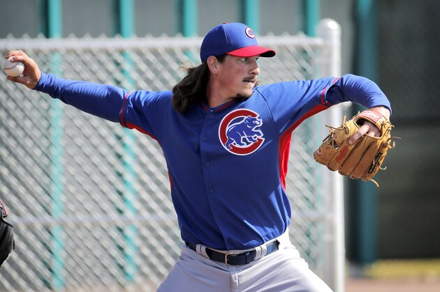 Chicago Cubs pitcher Jeff Samardzija throws during the team's first spring training baseball practice, Friday, Feb. 14, 2014, in Mesa, Ariz. (AP Photo/Matt York)