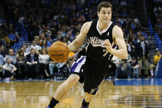 Sacramento Kings guard Jimmer Fredette (7) drives during an NBA basketball game against the Oklahoma City Thunder in Oklahoma City, Sunday, Jan. 19, 2014. Oklahoma City won 108-93.(AP Photo/Sue Ogrocki)