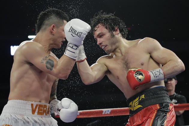Julio Cesar Chavez Jr., right, delivers a punch to Bryan Vera during a 12-round super middleweight bout, Saturday, March 1, 2014, in San Antonio. Chavez won by decision. (AP Photo/Eric Gay)