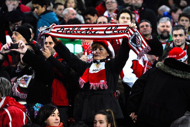BILBAO, SPAIN - FEBRUARY 02:  An Athletic Club fan holds a scarf as she cheer up her team during the La Liga match between Athletic Club and Real Madrid CF at San Mames Stadium on February 2, 2014 in Bilbao, Spain.  (Photo by David Ramos/Getty Images)