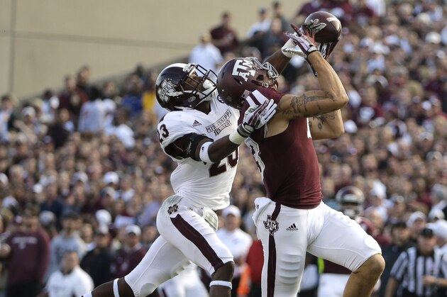 Mississippi State defensive back Taveze Calhoun (23) breaks up a pass intended for Texas A&M wide receiver Mike Evans (13) during the second quarter of an NCAA college football game Saturday, Nov. 9, 2013, in College Station, Texas. (AP Photo/David J. Phillip)