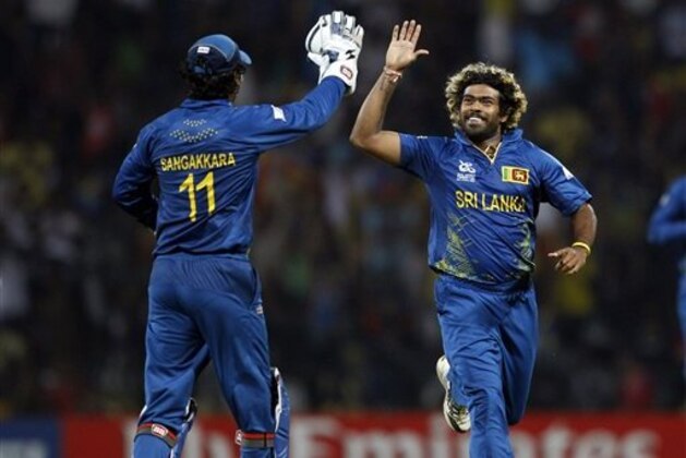 Sri Lanka's bowler Lasith Malinga, right, celebrates with teammate Kumar Sangakkara after taking the wicket of England's batsman Jos Buttler, not seen, during the ICC Twenty20 Cricket World Cup Super Eight match in Pallekele, Sri Lanka, Monday, Oct. 1, 2012. (AP Photo/Aijaz Rahi) Sri Lanka's bowler Lasith Malinga, right, celebrates with teammate Kumar Sangakkara after taking the wicket of England's batsman Jos Buttler, not seen, during the ICC Twenty20 Cricket World Cup Super Eight match in Pallekele, Sri Lanka, Monday, Oct. 1, 2012. (AP Photo/Aijaz Rahi)