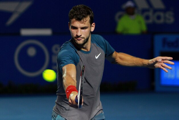 Bulgaria's Grigor Dimitrov returns the ball while playing against Britain's Andy Murray during a semi-final match of the Mexican Tennis Open in Acapulco, Mexico, Friday, Feb. 28, 2014. Murray lost in three sets to Dimitrov. (AP Photo/Jam Media- Hugo Avila)