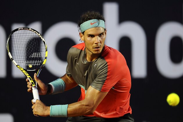RIO DE JANEIRO, BRAZIL - FEBRUARY 23: Rafael Nadal of Spain returns the ball to Alexandr Dolgopolov of Ukraine during the ATP Rio Open 2014 at Jockey Club Rio de Janeiro on February 23, 2014 in Rio de Janeiro, Brazil. (Photo by Buda Mendes/Getty Images)