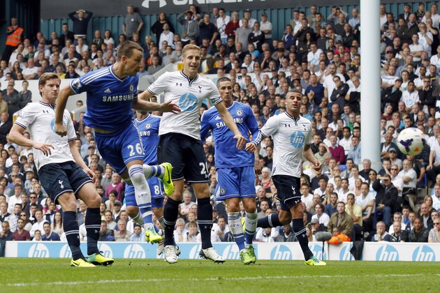 Chelsea's John Terry, second left, scores against Tottenham Hotspur, during their English Premier League soccer match at White Hart Lane, London, Saturday, Sept. 28, 2013. (AP Photo/Sang Tan)