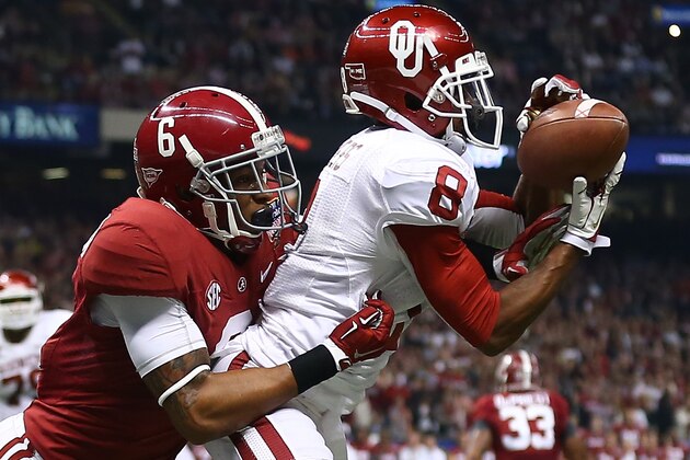 NEW ORLEANS, LA - JANUARY 02:  Jalen Saunders #8 of the Oklahoma Sooners scores a touchdown over Ha Ha Clinton-Dix #6 of the Alabama Crimson Tide during the Allstate Sugar Bowl at the Mercedes-Benz Superdome on January 2, 2014 in New Orleans, Louisiana.  (Photo by Streeter Lecka/Getty Images)