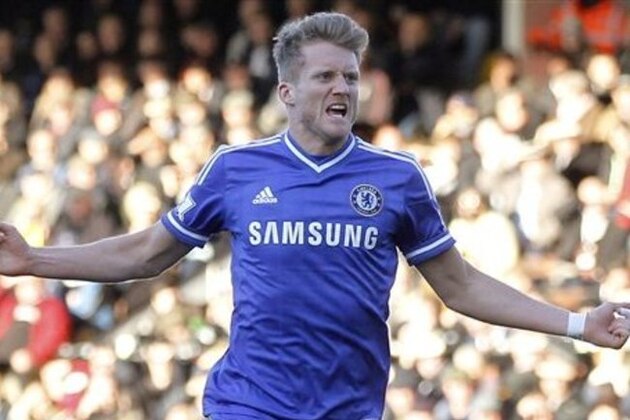 Chelsea's Andre Schurrle celebrates his goal against Fulham during their English Premier League soccer match at Craven Cottage, London, Saturday, March 1, 2014. (AP Photo/Sang Tan)