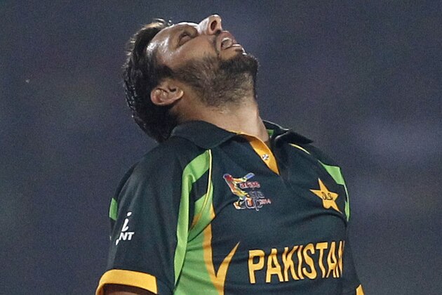 Pakistan’s Shahid Afridi looks up in celebration after taking the wicket of Afghnistan’s Asghar Stanikzai during the Asia Cup one-day international cricket tournament between them in Fatullah, near Dhaka, Bangladesh, Thursday, Feb. 27, 2014. (AP Photo/A.M. Ahad)
